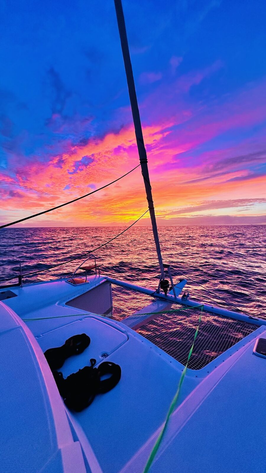 Catamaran sailing at sunset in the Bahamas