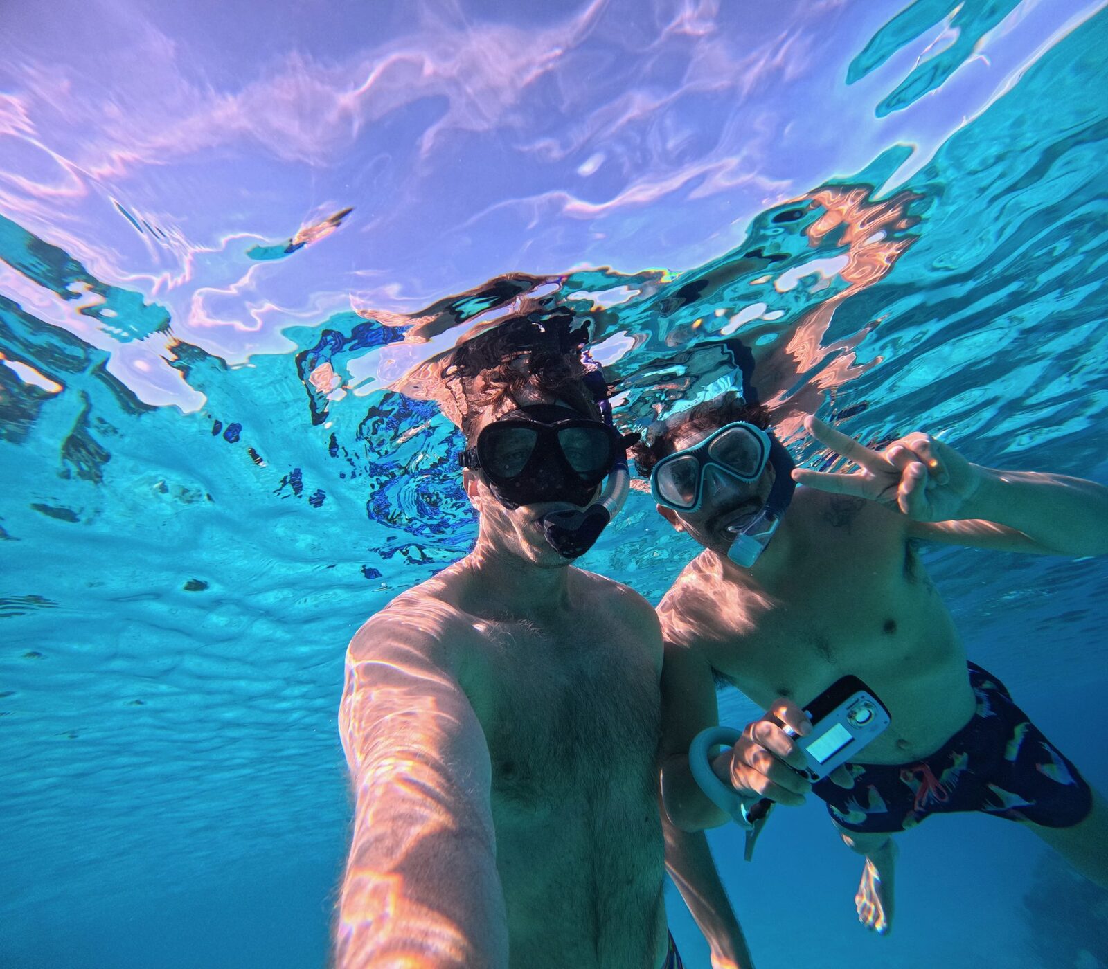 Two guests snorkeling together in the Exumas