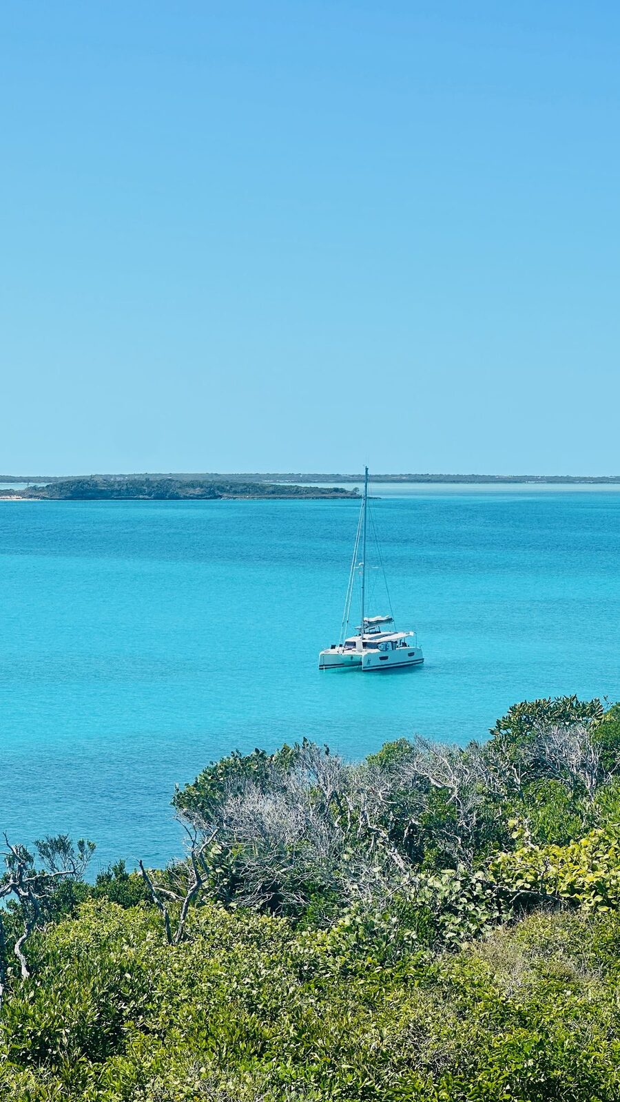 Catamaran anchored in a turquoise Exumas cove